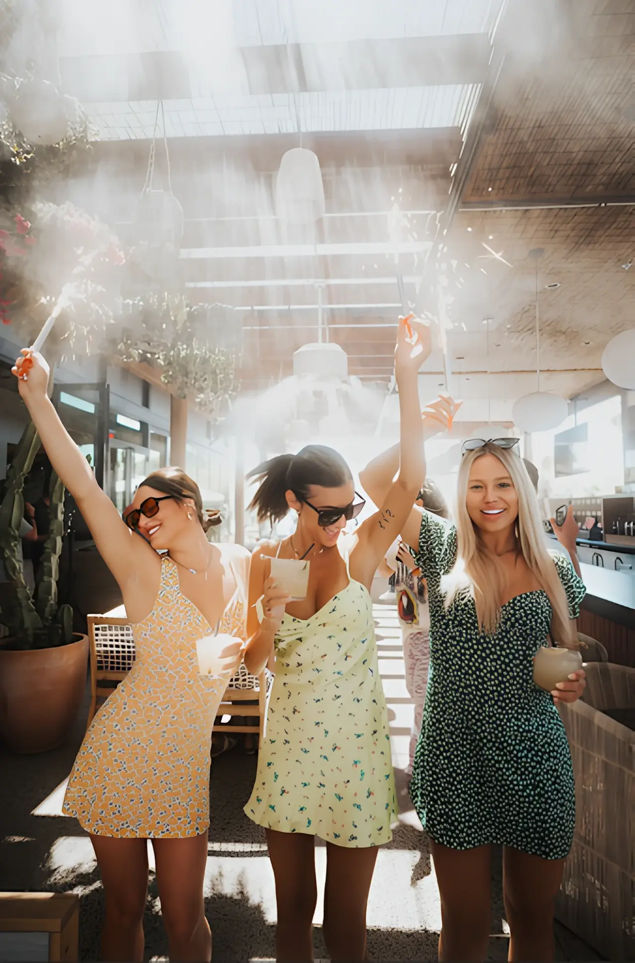 Friends dancing with sparklers at CALA