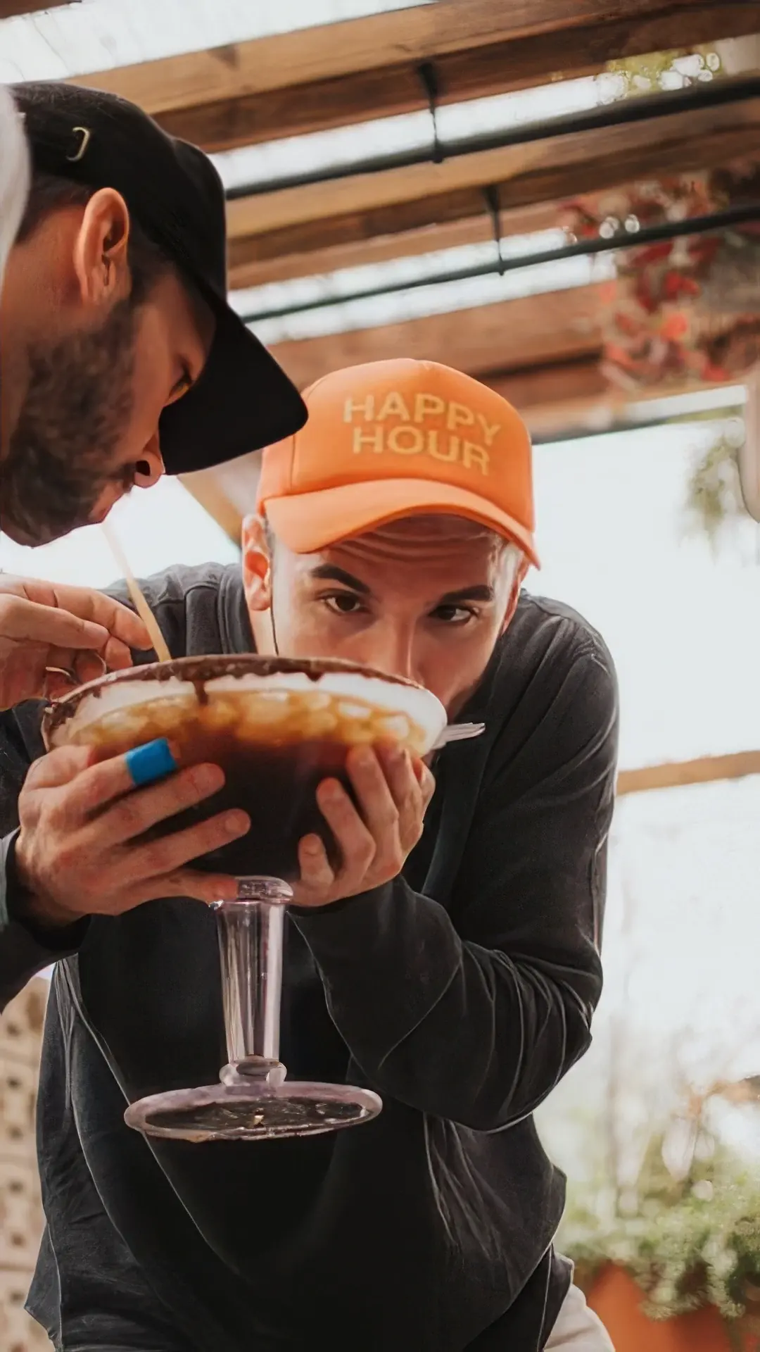 A guest with a giant cocktail at CALA