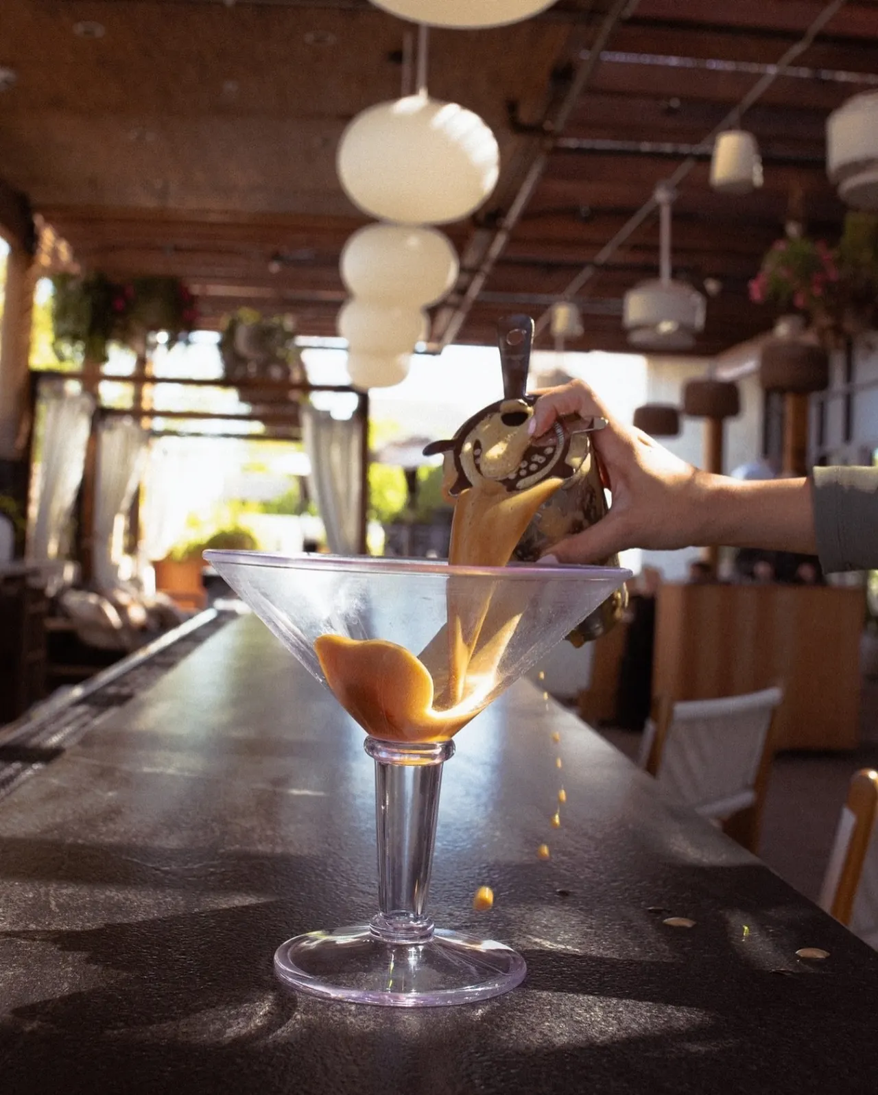 An espresso martini poured at the bar
