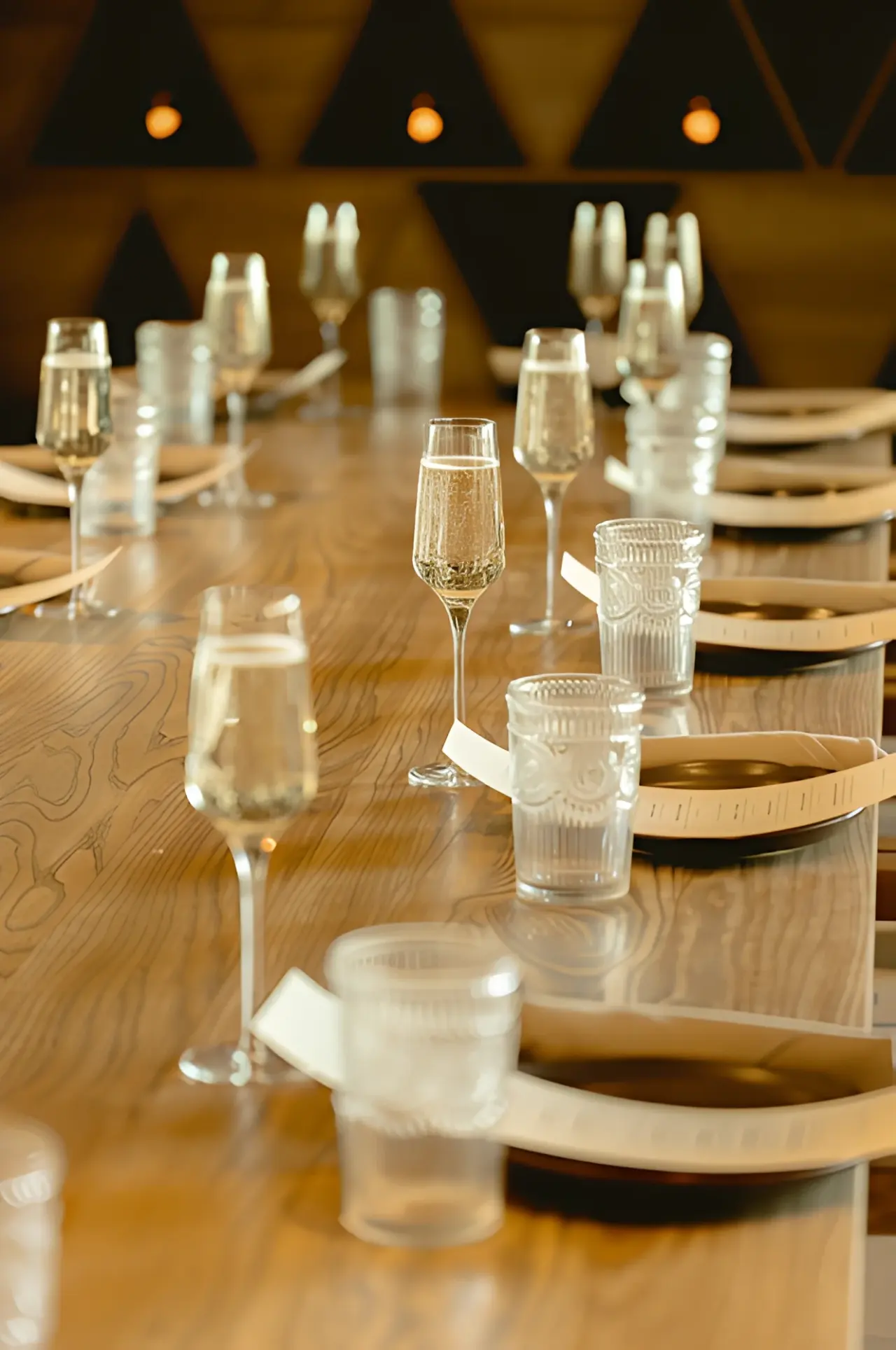 A table set with champagne and personalized menus