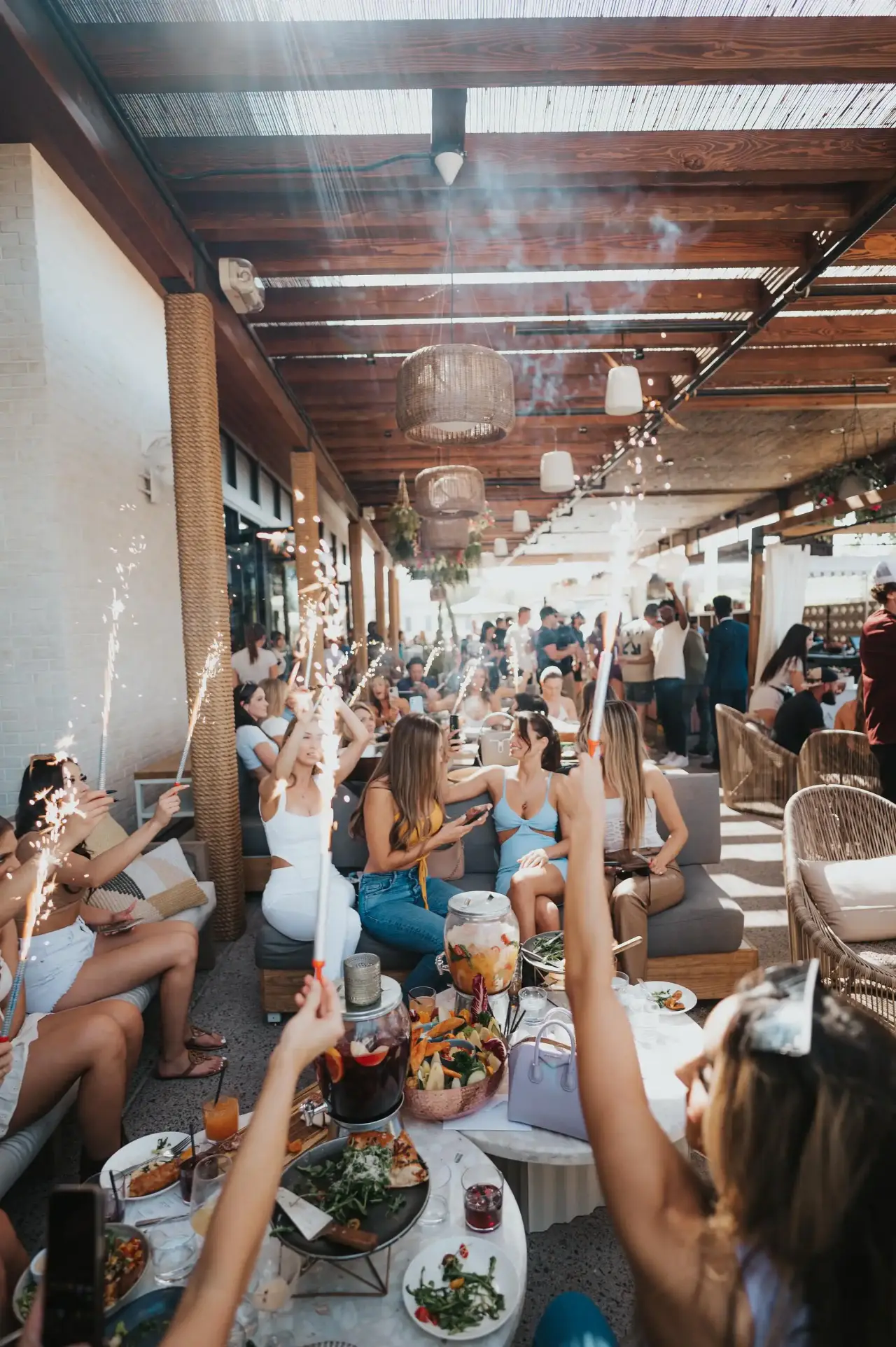 A packed patio party at CALA