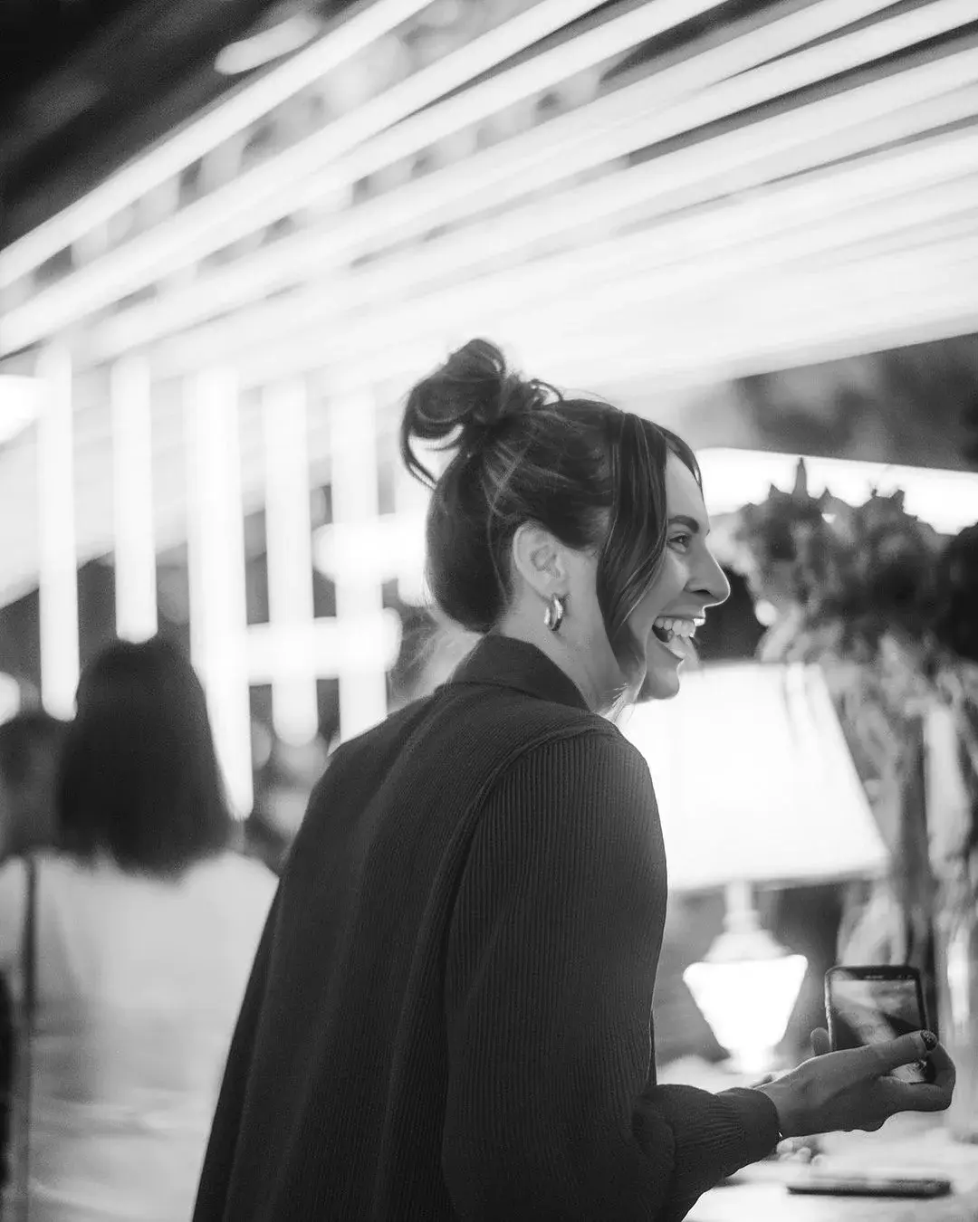 A guest laughing at the bar