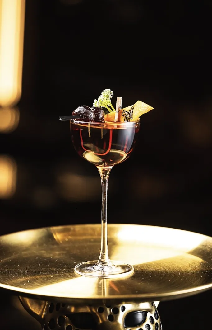 A martini on a gold tray