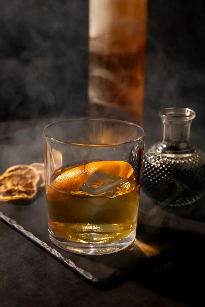 A smoky old fashioned with an orange twist